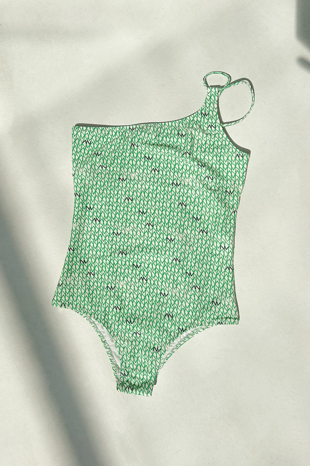Groen asymmetrisch badpak