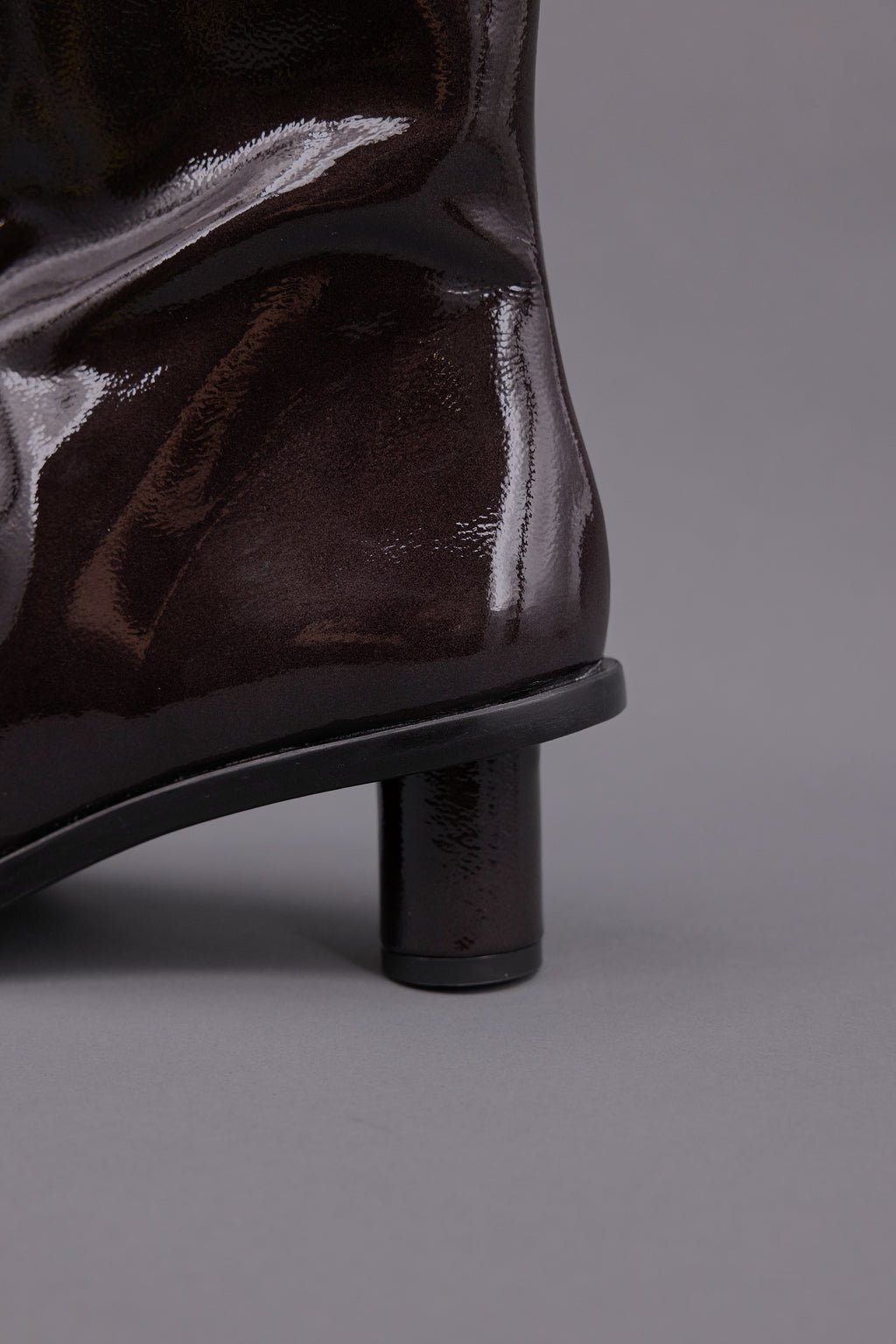 Gilda ankle booth in patent after dark