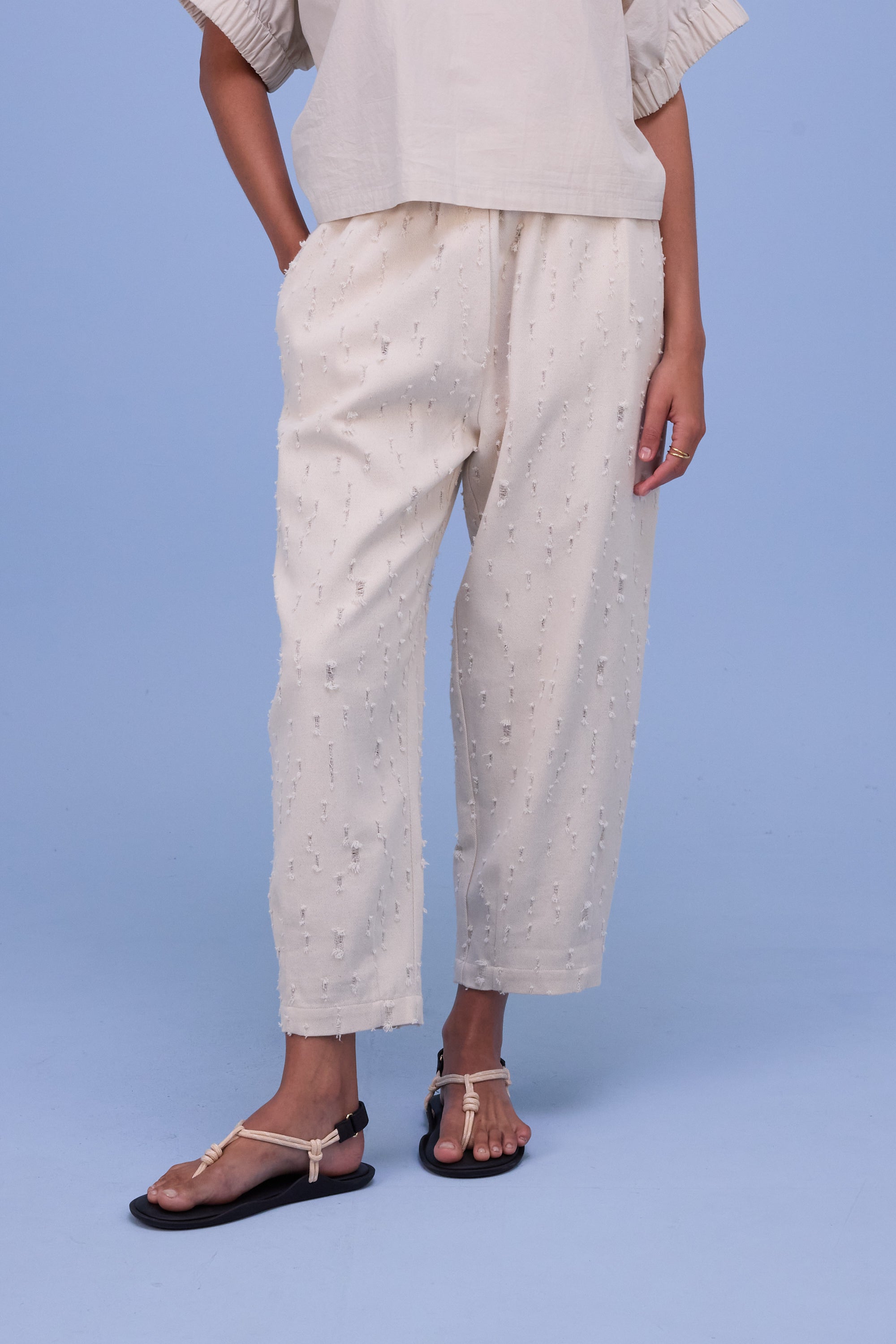 Hacene trousers in ecru ripped cotton