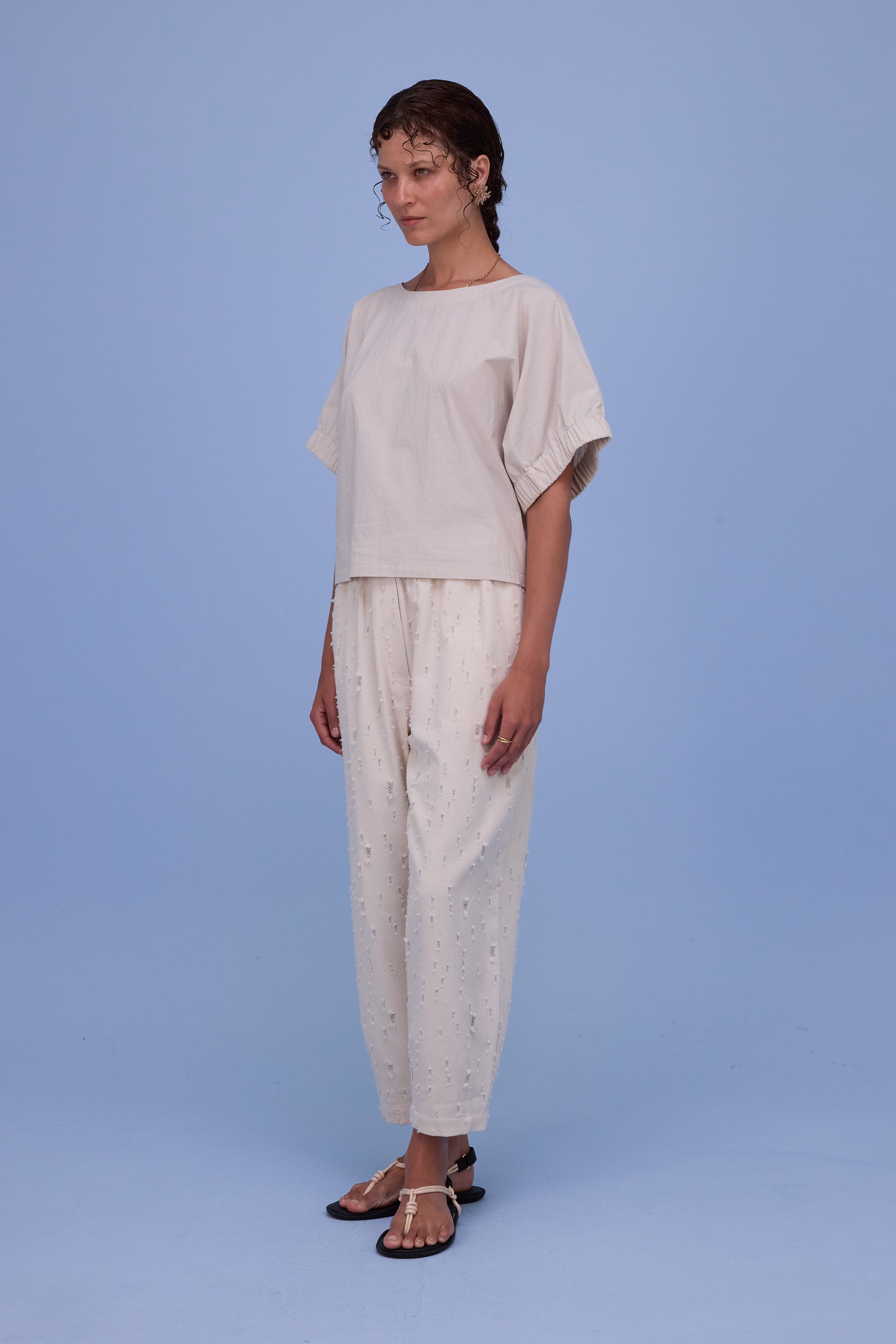 Hacene trousers in ecru ripped cotton