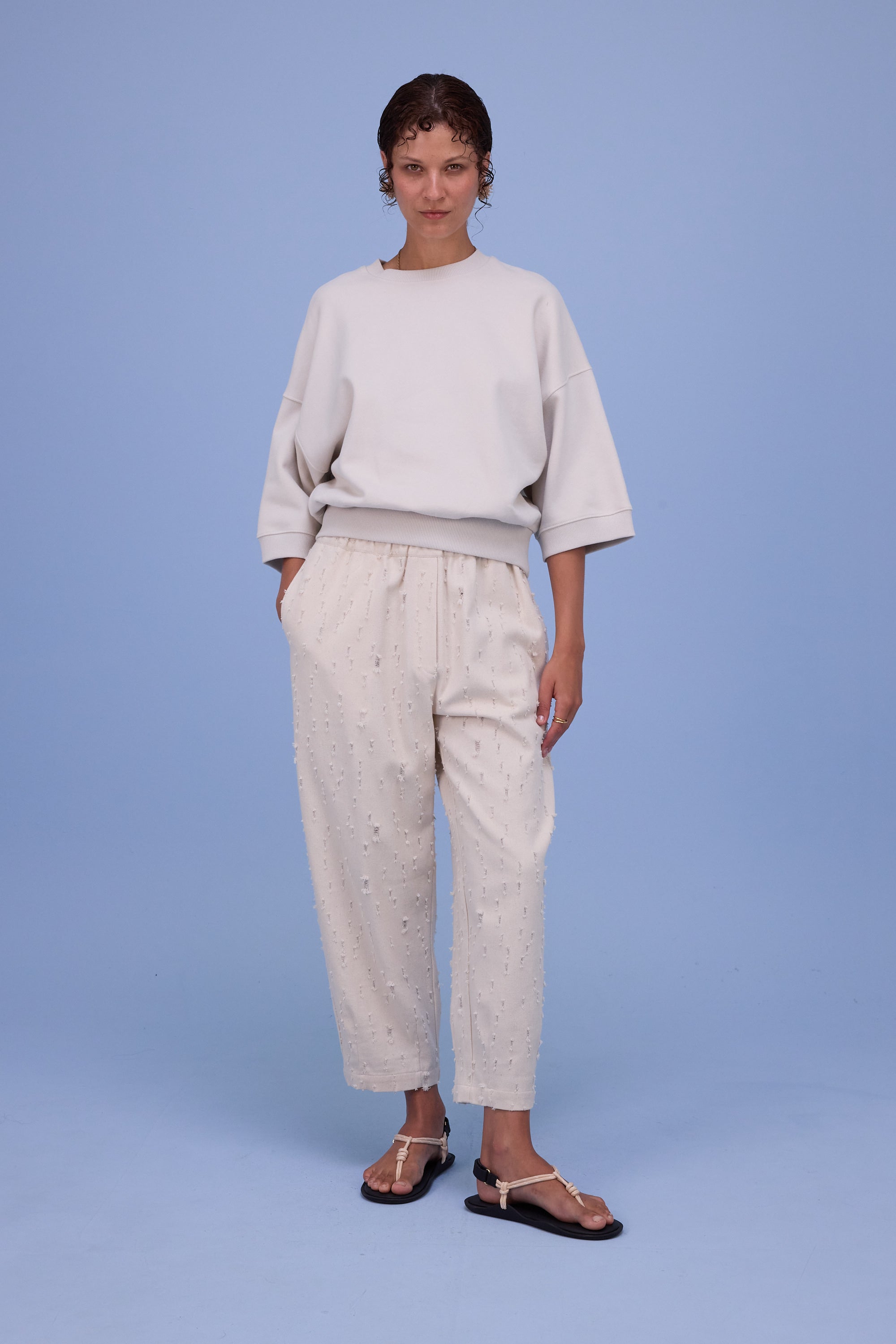 Hacene trousers in ecru ripped cotton