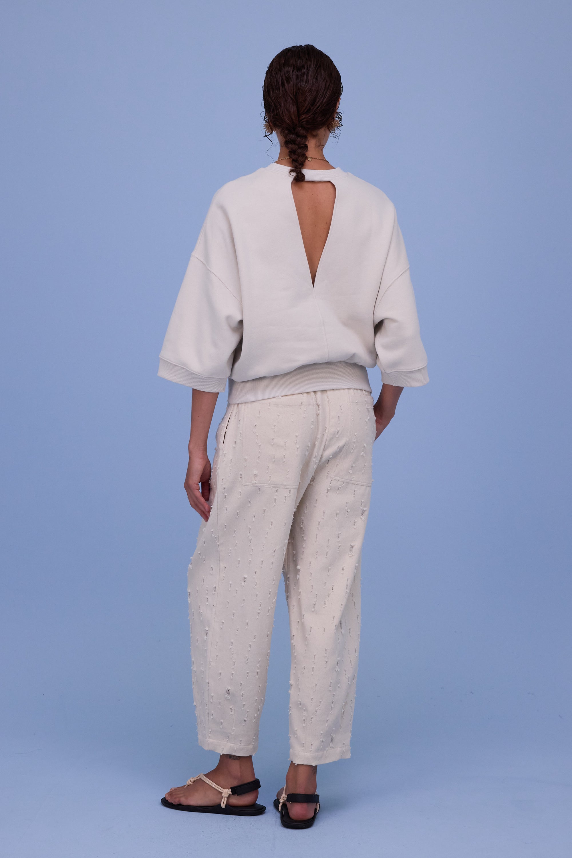 Hacene trousers in ecru ripped cotton